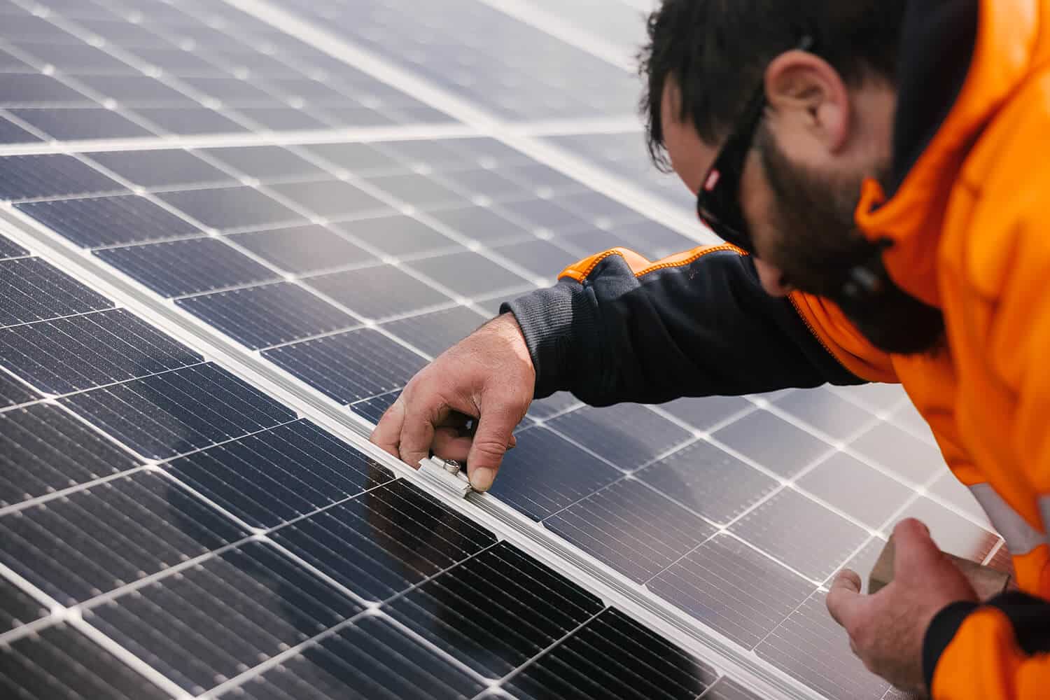 close up of SES Electrical electrician and solar panels