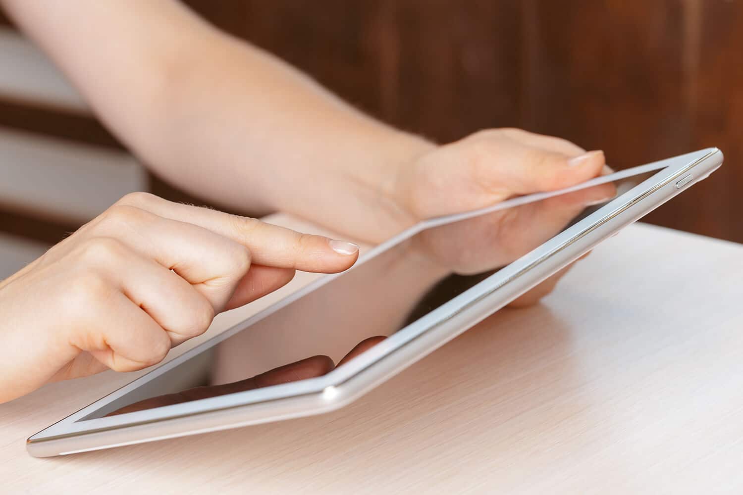 person holding digital tablet