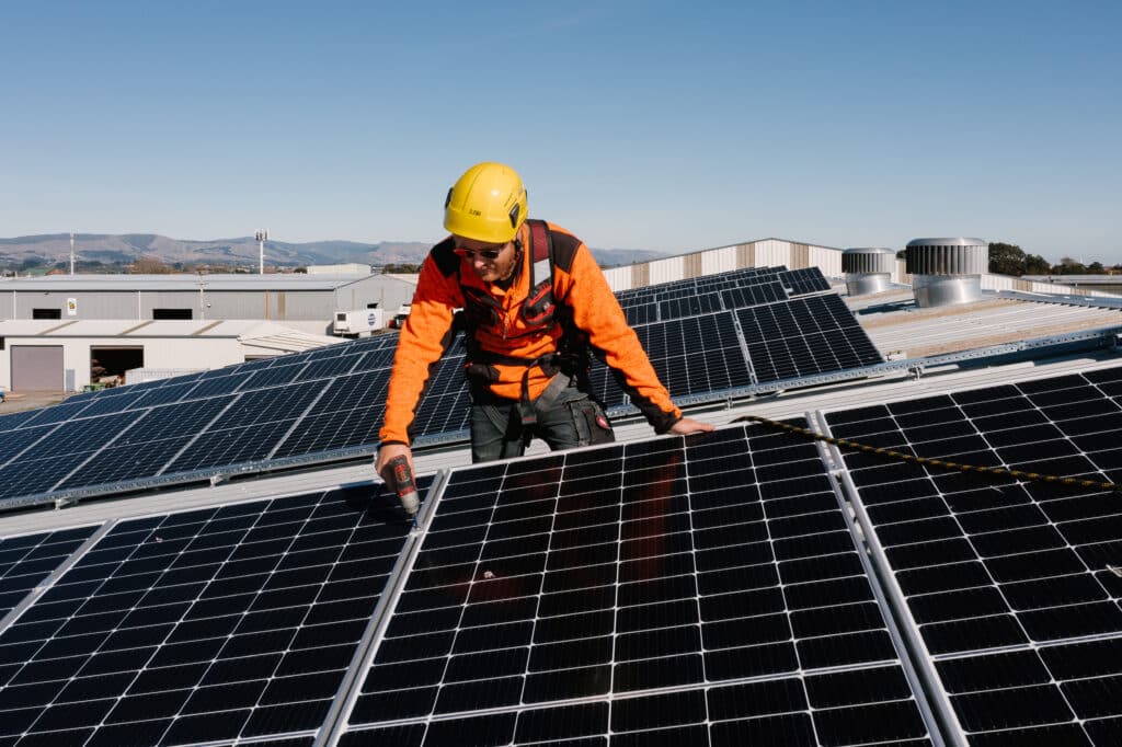 SES Electrical installing solar panels on rooftop